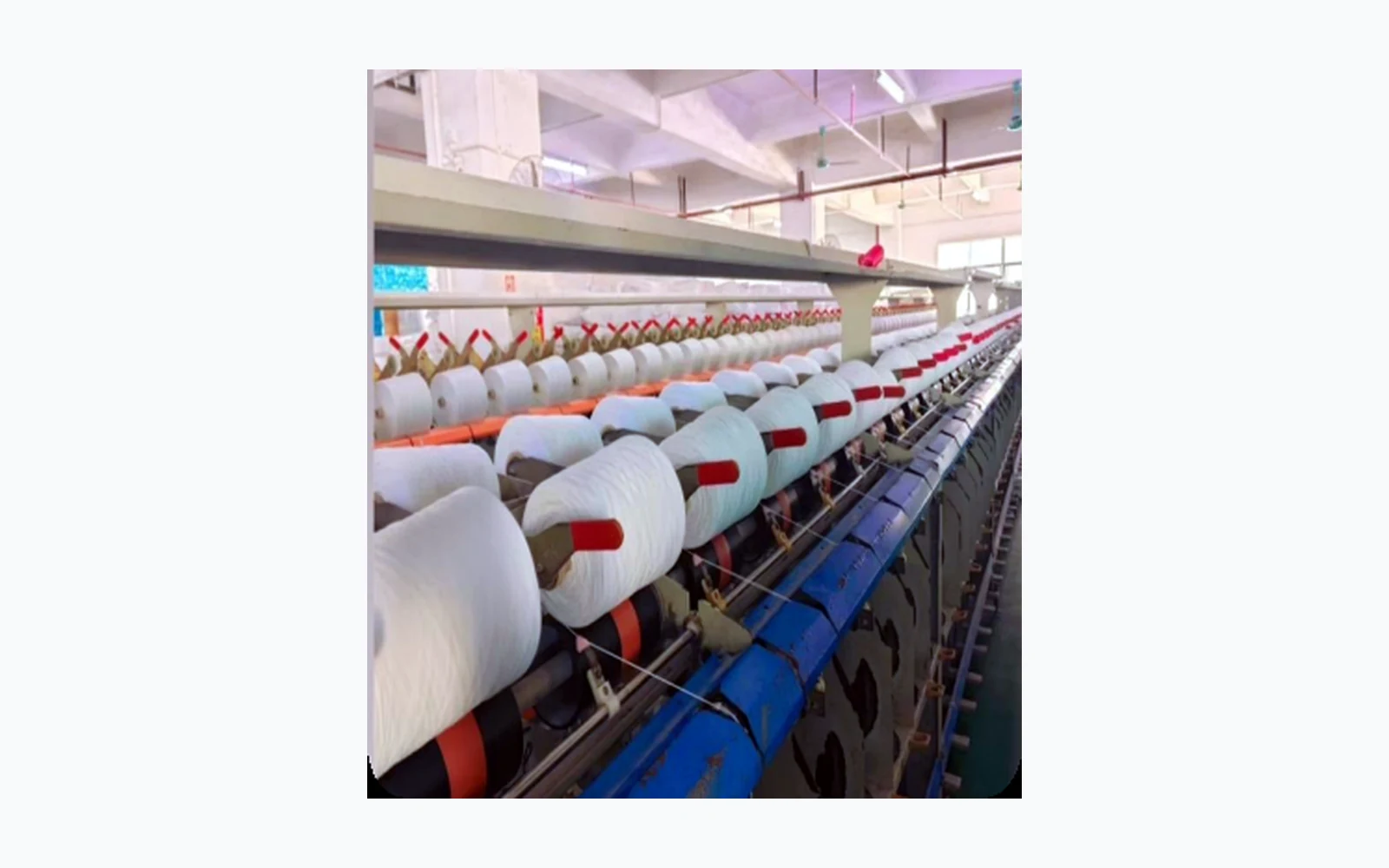 Spool production line with red bobbins for cable manufacturing
