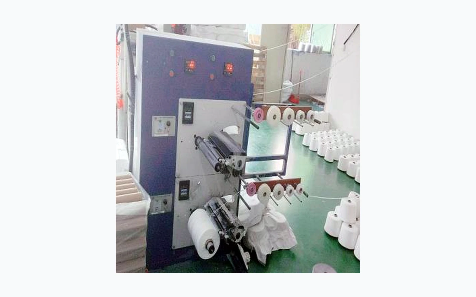 Taping and winding equipment in cable factory workshop